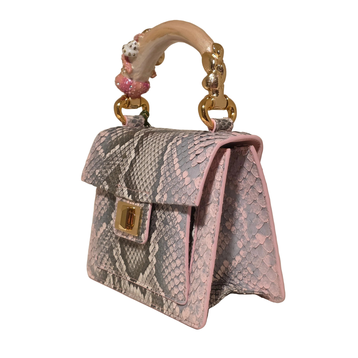 Biagini Art Bag –

Handcrafted in Bologna, Italy since 1968, the Biagini Art Bag is a masterclass in exquisite Italian artistry and uncompromising luxury. Designed to make a statement, this piece showcases genuine python finishes paired with rich, sumptuous suede interior lining. Every detail is meticulously finished, featuring a distinctive hand-painted enameled brass handle and gleaming gold-tone hardware.

Craftsmanship: Made in Italy
Brought to you by Rise And Shine Haven - BellaBarra.store