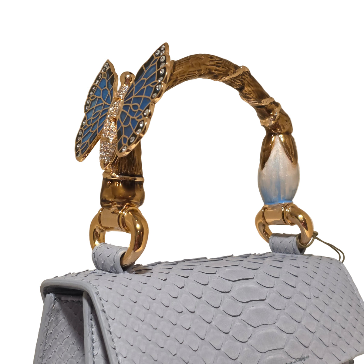 Biagini Art Bag –

Handcrafted in Bologna, Italy since 1968, the Biagini Art Bag is a masterclass in exquisite Italian artistry and uncompromising luxury. Designed to make a statement, this piece showcases genuine python finishes paired with rich, sumptuous suede interior lining. Every detail is meticulously finished, featuring a distinctive hand-painted enameled brass handle and gleaming gold-tone hardware.

Craftsmanship: Made in Italy
Brought to you by Rise And Shine Haven - BellaBarra.store