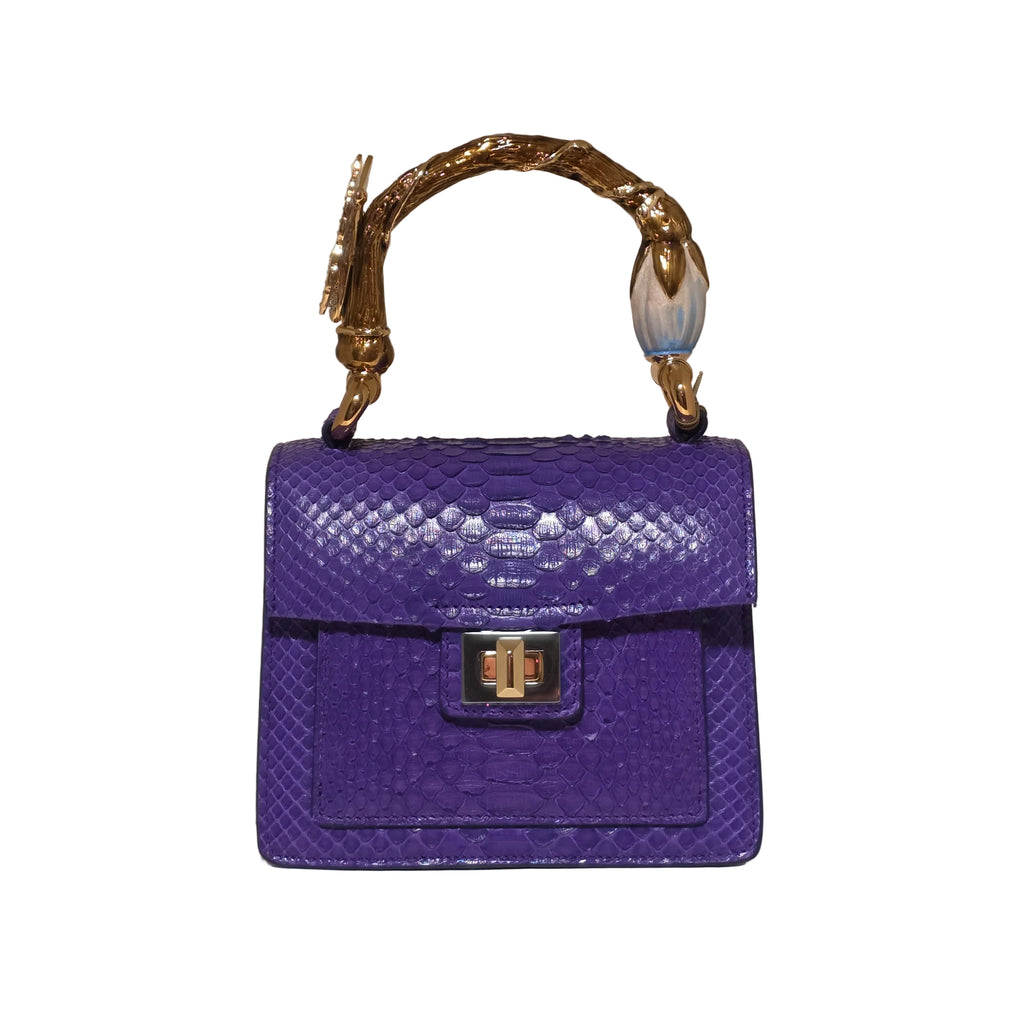 Biagini Art Bag –

Handcrafted in Bologna, Italy since 1968, the Biagini Art Bag is a masterclass in exquisite Italian artistry and uncompromising luxury. Designed to make a statement, this piece showcases genuine python finishes paired with rich, sumptuous suede interior lining. Every detail is meticulously finished, featuring a distinctive hand-painted enameled brass handle and gleaming gold-tone hardware.

Craftsmanship: Made in Italy
Brought to you by Rise And Shine Haven - BellaBarra.store