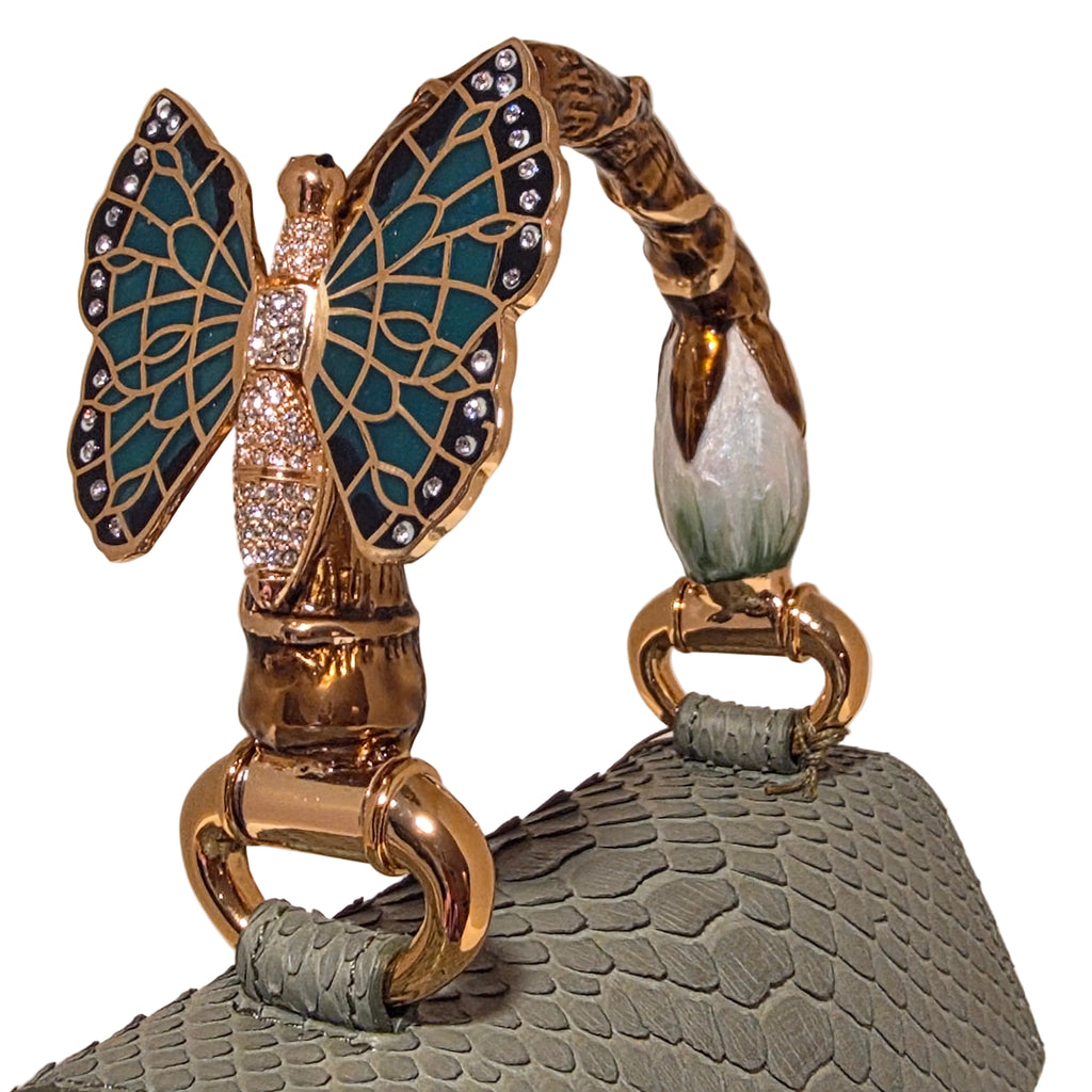 Biagini Art Bag –

Handcrafted in Bologna, Italy since 1968, the Biagini Art Bag is a masterclass in exquisite Italian artistry and uncompromising luxury. Designed to make a statement, this piece showcases genuine python finishes paired with rich, sumptuous suede interior lining. Every detail is meticulously finished, featuring a distinctive hand-painted enameled brass handle and gleaming gold-tone hardware.

Craftsmanship: Made in Italy
Brought to you by Rise And Shine Haven - BellaBarra.store