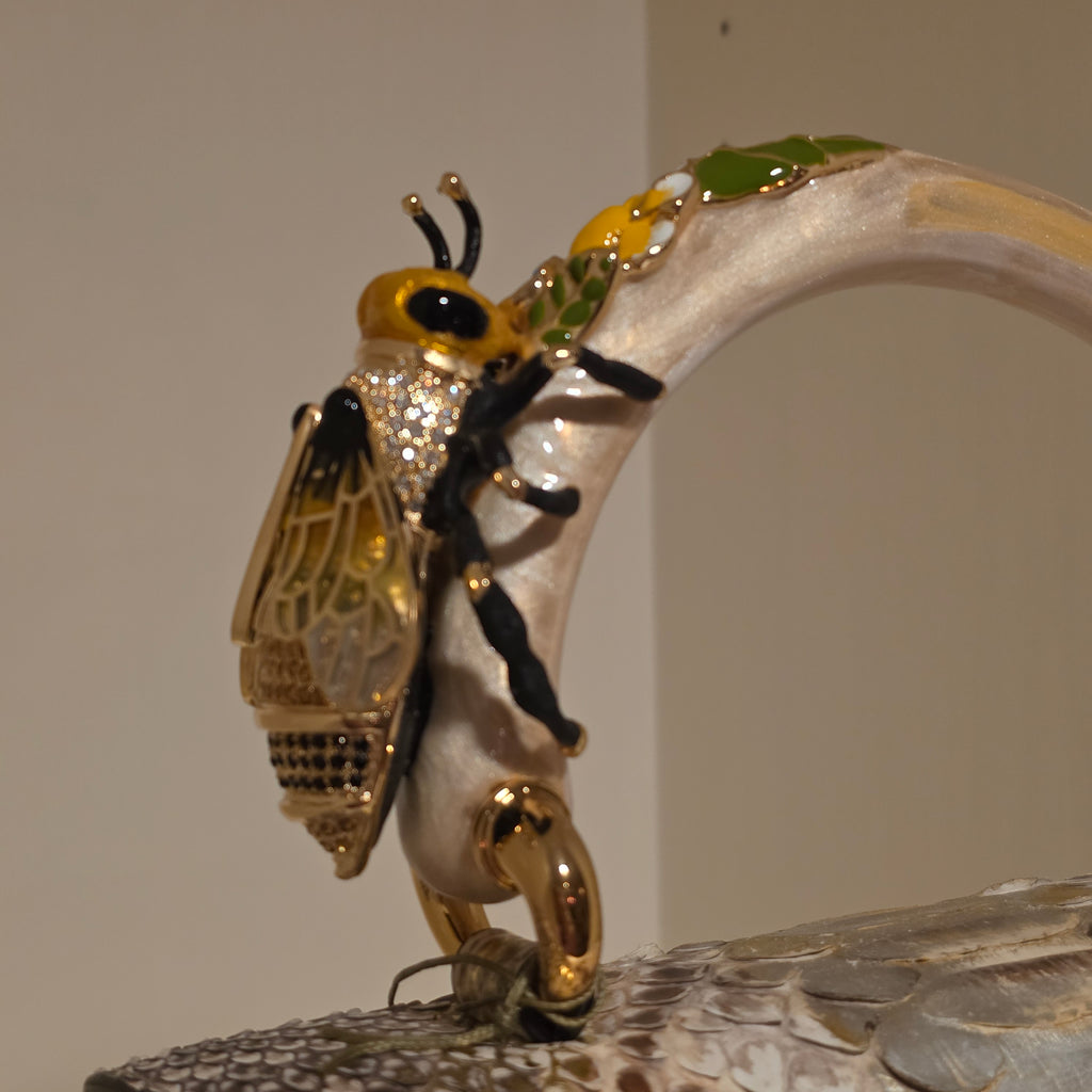 Biagini Art Bag –

Handcrafted in Bologna, Italy since 1968, the Biagini Art Bag is a masterclass in exquisite Italian artistry and uncompromising luxury. Designed to make a statement, this piece showcases genuine python finishes paired with rich, sumptuous suede interior lining. Every detail is meticulously finished, featuring a distinctive hand-painted enameled brass handle and gleaming gold-tone hardware.

Craftsmanship: Made in Italy
Brought to you by Rise And Shine Haven - BellaBarra.store