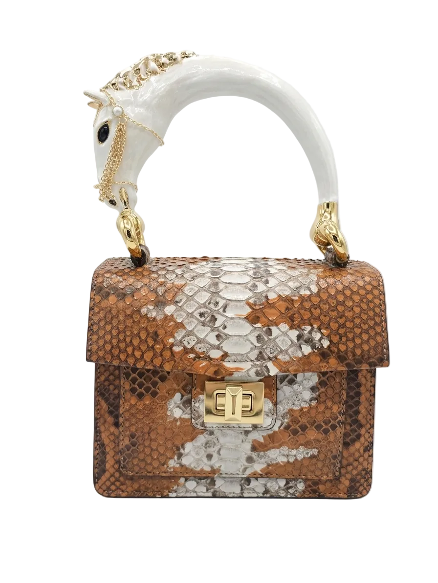 Biagini Art Bag –

Handcrafted in Bologna, Italy since 1968, the Biagini Art Bag is a masterclass in exquisite Italian artistry and uncompromising luxury. Designed to make a statement, this piece showcases genuine python finishes paired with rich, sumptuous suede interior lining. Every detail is meticulously finished, featuring a distinctive hand-painted enameled brass handle and gleaming gold-tone hardware.

Craftsmanship: Made in Italy
Brought to you by Rise And Shine Haven - BellaBarra.store