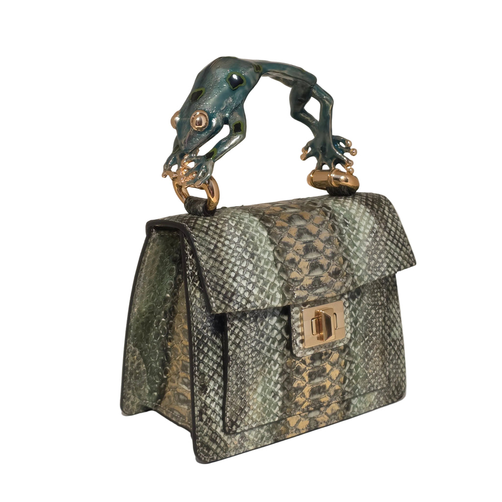Biagini Art Bag –

Handcrafted in Bologna, Italy since 1968, the Biagini Art Bag is a masterclass in exquisite Italian artistry and uncompromising luxury. Designed to make a statement, this piece showcases genuine python finishes paired with rich, sumptuous suede interior lining. Every detail is meticulously finished, featuring a distinctive hand-painted enameled brass handle and gleaming gold-tone hardware.

Craftsmanship: Made in Italy
Brought to you by Rise And Shine Haven - BellaBarra.store