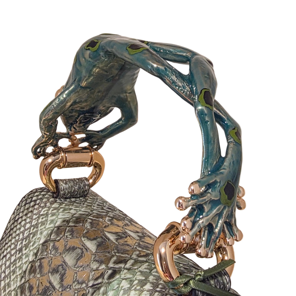 Biagini Art Bag –

Handcrafted in Bologna, Italy since 1968, the Biagini Art Bag is a masterclass in exquisite Italian artistry and uncompromising luxury. Designed to make a statement, this piece showcases genuine python finishes paired with rich, sumptuous suede interior lining. Every detail is meticulously finished, featuring a distinctive hand-painted enameled brass handle and gleaming gold-tone hardware.

Craftsmanship: Made in Italy
Brought to you by Rise And Shine Haven - BellaBarra.store