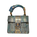 Biagini Art Bag –

Handcrafted in Bologna, Italy since 1968, the Biagini Art Bag is a masterclass in exquisite Italian artistry and uncompromising luxury. Designed to make a statement, this piece showcases genuine python finishes paired with rich, sumptuous suede interior lining. Every detail is meticulously finished, featuring a distinctive hand-painted enameled brass handle and gleaming gold-tone hardware.

Craftsmanship: Made in Italy
Brought to you by Rise And Shine Haven - BellaBarra.store