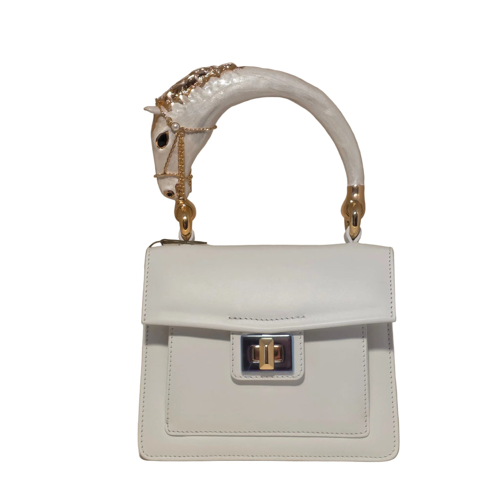 Biagini Art Bag –

Handcrafted in Bologna, Italy since 1968, the Biagini Art Bag is a masterclass in exquisite Italian artistry and uncompromising luxury. Designed to make a statement, this piece showcases genuine python finishes paired with rich, sumptuous suede interior lining. Every detail is meticulously finished, featuring a distinctive hand-painted enameled brass handle and gleaming gold-tone hardware.

Craftsmanship: Made in Italy
Brought to you by Rise And Shine Haven - BellaBarra.store