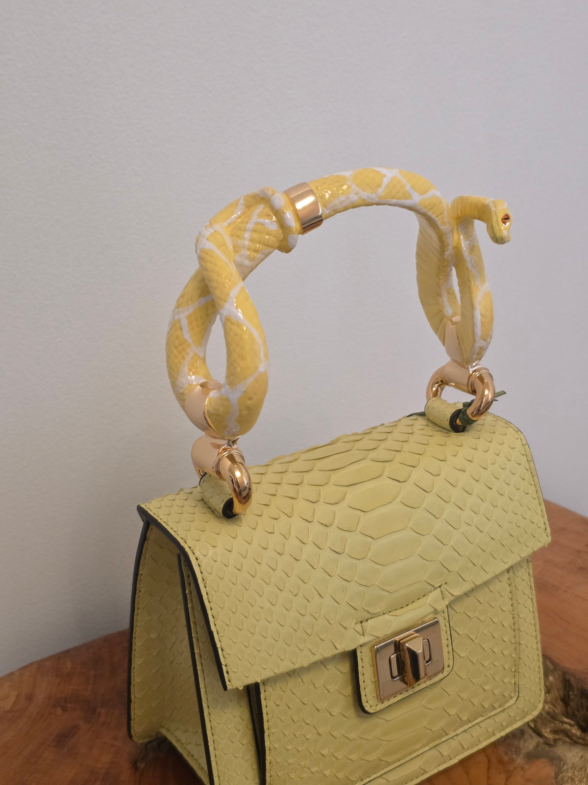 Biagini Art Bag –

Handcrafted in Bologna, Italy since 1968, the Biagini Art Bag is a masterclass in exquisite Italian artistry and uncompromising luxury. Designed to make a statement, this piece showcases genuine python finishes paired with rich, sumptuous suede interior lining. Every detail is meticulously finished, featuring a distinctive hand-painted enameled brass handle and gleaming gold-tone hardware.

Craftsmanship: Made in Italy
Brought to you by Rise And Shine Haven - BellaBarra.store