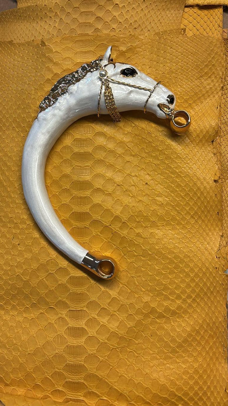 Biagini Art Bag

Handcrafted in Bologna, Italy since 1968, the Biagini Art Bag is a masterclass in exquisite Italian artistry and uncompromising luxury. Designed to make a statement, this piece showcases genuine python finishes paired with rich, sumptuous suede interior lining. Every detail is meticulously finished, featuring a distinctive hand-painted enameled brass handle and gleaming gold-tone hardware.